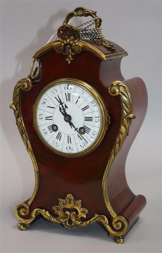 A 20th century french, lacquered mantel clock. height 29cm